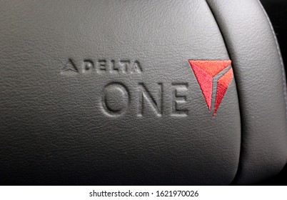 SYDNEY, AUSTRALIA TO LOS ANGELES, USA – NOVEMBER 12 2019: Delta Air Lines' Delta One logo on display on board a Boeing 777 aircraft in the Delta One Suites cabin.