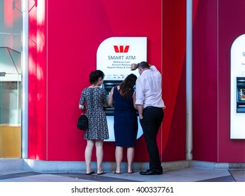 Sydney, Australia - Mar 26, 2016: People Making Transactions On Westpac ATM, Sydney, Australia. It Is One Of Australia's 