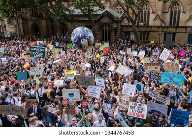 Sydney, Australia - March 15, 2019 - 20 000 Australian students gather in climate change protest rally, School Strike 4 Climate, and march from Sydney Town Hall Square to Hyde Park.
