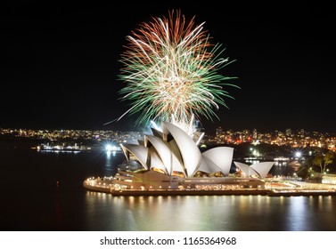 SYDNEY, AUSTRALIA - MARCH 8, 2018 - Colorful Mix Of Orange, Green, And White Fireworks Over The Sydney Opera House