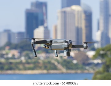 Sydney, Australia - May 11, 2017: A DJI Mavic Pro Drone Flying Near City Centre. Many Countries Have Implemented Laws To Regulate The Use Of Drones To Ensure Public Safety.