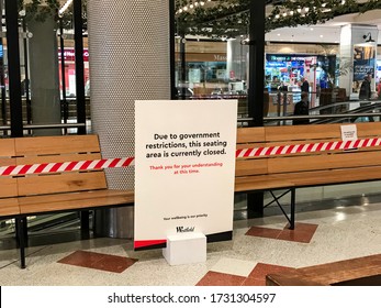 Sydney, Australia May 2020 Closure Notice Near The Wooden Bench At The Food Court At Westfield Miranda. 