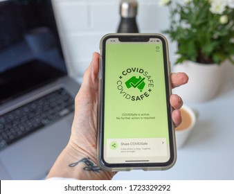 Sydney, Australia - May 6 2020: Australian Worker Uses COVIDSafe, A Smart Phone App Developed By The Government To Track And Trace Covid-19 Infections During The Pandemic.