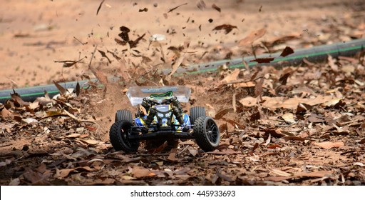 Sydney, Australia - November 30, 2014. Radio Controlled Buggy Car Model In Race, Internal Combustion Engine On A Bumpy Red Clay Road. (St Ives Showground, Sydney, Australia)