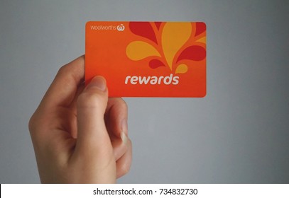 Sydney, Australia - October 15, 2017: Female Caucasian Hand Is Holding A Woolworths Rewards Loyalty Card, This Loyalty Program Gives Money Off Shopping At Woolworths Supermarkets.