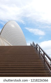 Sydney, Australia - October 20, 2018: Close Up Of Sail Of Sydney Opera House With Nobody On Empty Stairs And Handrail, Blue Sky And Clouds As Background.