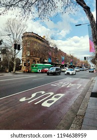 SYDNEY, AUSTRALIA - OCTOBER 3, 2018:Traffic Signs Bus Lane Reserved Lane On Asphalt Road With Beautiful Building And Blue Sky Background In Australia  (Take A Picture By Smartphone)