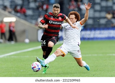 SYDNEY, AUSTRALIA - OCTOBER 9: Brandon Borrello Of Western Sydney Wanderers Competes For The Ball With Mustafa Amini Of Perth Glory During The Match Between Western Sydney Wanderers FC And Perth Glory