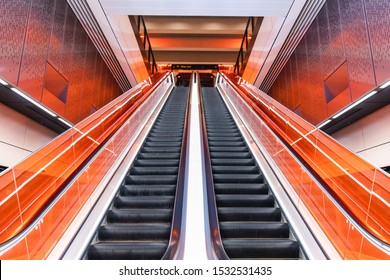 Sydney, Australia - September 19, 2019: Empty Escalator At Sydney Metro Station With Red Glass On The Side. 