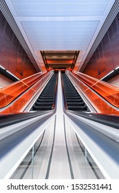 Sydney, Australia - September 19, 2019: Empty Escalator At Sydney Metro Station With Red Glass On The Side. 