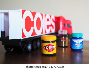 SYDNEY, AUSTRALIA - SEPTEMBER 6, 2019: Closeup mini Vegemite toy with Coles' delivery truck and other minis as background