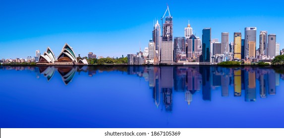 Sydney CBD skyline with reflection of buildings in the harbour waters  - Powered by Shutterstock