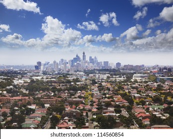 Sydney City CBD Aerial View From Helicopter Above Surrounding Residential Suburbs Blue Cloudy Sky