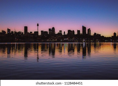 Sydney City Dawn. Silhouette Nimbostratus Sunrise Seascape Over Sea Water With Water Reflections.

Captured In New South Wales, Australia.