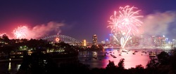 Sydney City Fireworks New Year Celebration Light Show Dusk Lights Reflection In Harbour Over CBD And Bridge