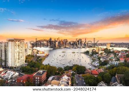 Sydney harbour bridge, Panorama view of Sydney city skyline with Sydney harbour bridge north shore in sunset sky, Australia