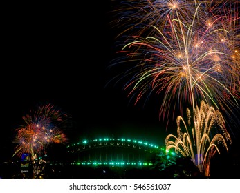 The Sydney Harbour Bridge is surrounded by fireworks welcoming in 2017