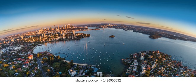 Sydney Harbour sunrise aerial photo with curvature - Shutterstock ID 1426953332