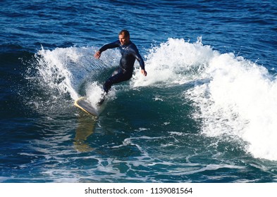 Sydney, New South Wales, Australia. July 2018. A surfer in action at Cronulla Beach in Sydney's south.