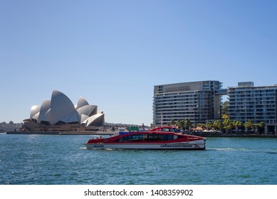 Sydney, New South Wales, Australia- 21 April 2019: Captain Cook Cruises Ferry In The Sea, Sydney Opera House In The Background.