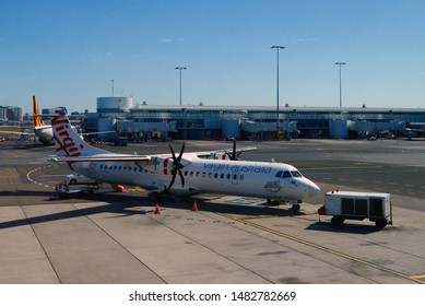 Sydney, New South Wales, Australia. Aug 2019. Ground Crew Prepare A Virgin Aircraft For Another Flight At Sydney's Domestic Terminals.