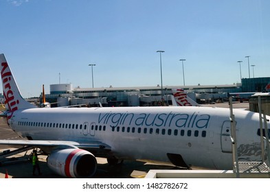 Sydney, New South Wales, Australia. Aug 2019. Ground Crew Prepare A Virgin Aircraft For Another Flight At Sydney's Domestic Terminals.