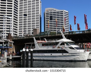 Sydney, New South Wales, Australia. Sept 2019. A View Of The Captain Cook Cruiser Moored At Darling Harbour By The Pyrmont Bridge With The Sydney Skyline In The Background. 