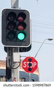 Sydney, New South Wales, Australia. 12/27/2019. Green Light Sign, Traffic Sign - Green Car Sign With Stop Sign At Headlight And Turn Right Turn.