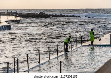 Sydney, New South Wales, Australia. March 10, 2022. Council Employees Cleaning Seaweed From The Ocean Baths At Clovelly After Large Storms And Floods Swept Through Sydney 