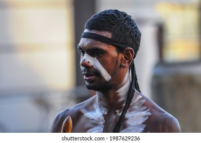 Sydney, New South Wales-Australia; 06-26-2021: Australian Aboriginal performing a street performance with traditional wind instruments in Sydney Harbor