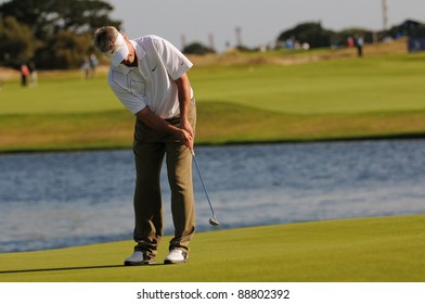 SYDNEY - NOV 11: - John Cook putts from 50 feet at the Emirates Australian Open at The Lakes golf course. Sydney - November 11, 2011