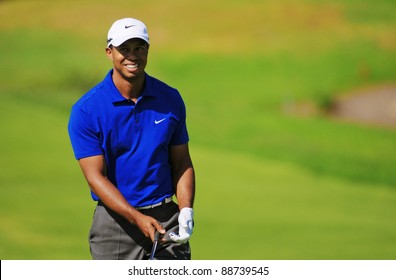 SYDNEY - NOVEMBER 12 - American golfer Tiger Woods plays a iron from the fairway third round at the Emirates Australian Open at The Lakes golf course. Sydney - November 12, 2011