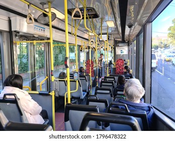 Sydney NSW Australia - 18 AUG 2020: Interior Of Sydney Public Transport Bus With Commuter. People Use Opal Cashless Card To Commute By Tap On And Off. Wheelchair Accessible Bus With Disablity Seats