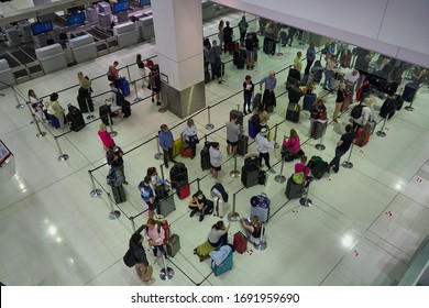 Sydney, NSW, Australia 3.04.2020: Queue To Check In At Sydney Airport. Because Of The Coronavirus Epidemic, People Are At A Safe Distance From Each Other.