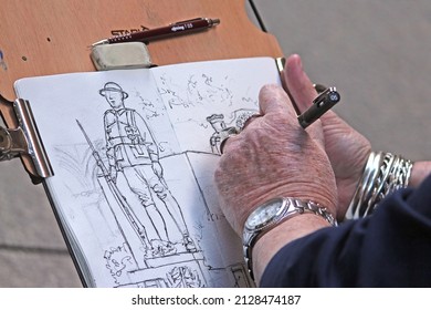 Sydney, NSW Australia - April 25 2021: Anzac Day. Senior Woman Drawing Soldier Statues At The Sydney Cenotaph