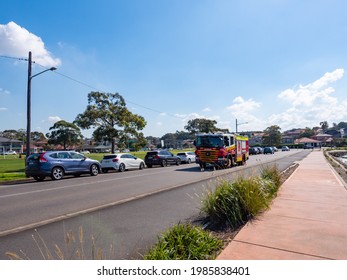 Sydney NSW Australia - April 28th 2021 - Henley Marine Road A Fire Rescue Truck Driving Past On A Sunny Winter Afternoon