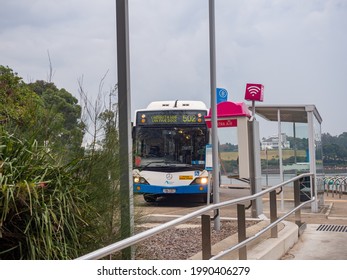 Sydney NSW Australia - April 29th 2021 - Bus 502 Cabarita Wharf Via Five Dock  Parked at Stop and Telstra Internet Hotspot on a sunny Autumn afternoon