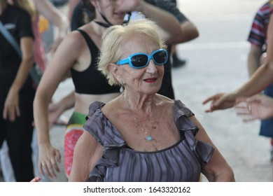 Sydney, NSW Australia - February 11 2020: Civil DiscoBedience Rally For Climate Change, The Greens NSW. Senior Woman Dancing Disco With Other Dancing Activists At The Protest.