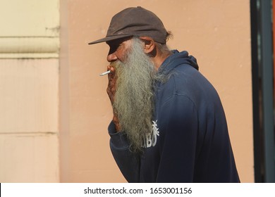 Sydney, NSW Australia - February 11 2020: The Extreme Cost Of Cigarettes Is Having A Disastrous Consequence. Pictured Is An Older Man (possibly Homeless) Bearded Smoking A Cigarette.