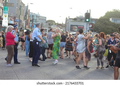 Sydney, NSW Australia - February 11 2020: Civil DiscoBedience Rally For Climate Change. Protestors Defy Traffic On Newtown's Busiest Intersection To Dance On The Road, Then Police Arrived.