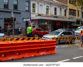 Sydney, NSW / Australia - Jan. 25 2020: Policeman Controls Traffic