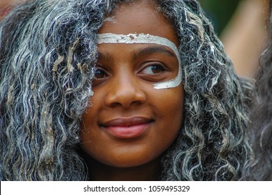SYDNEY, NSW, AUSTRALIA - JANUARY 26, 2009: A member of Koomurri Aboriginal Dance Troupe taking part in a traditional Australian Aboriginal smoking ceremony on the sacred land of the Gadigal People.