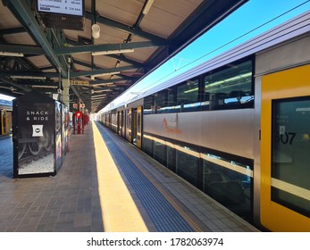 SYDNEY, NSW, Australia - Jun 20 2020: Empty Train Platform At Central Station With Yellow Long Heavy Rail Train Ready To Depart On A Bright Sunny Day. Public Transport By Tfnsw 