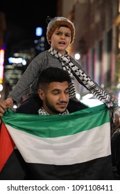 SYDNEY, NSW / AUSTRALIA - May 15, 2018: A Man Holds A Child On His Shoulders At A Demonstration Held To Mark 70 Years Since The Palestinian Exodus (Nakba) In 1948.