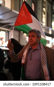 SYDNEY, NSW / AUSTRALIA - May 15, 2018: A Man Holds A Palestinian Flag At A Demonstration Held To Mark 70 Years Since The Palestinian Exodus (Nakba) In 1948.