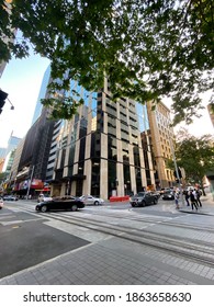 Sydney, NSW, Australia. November 27, 2020. Newly Completed Office Building On Corner Of George And Margaret St, Part Of Wynyard Place. Wide-angle View With Cars Going By On A Quiet Friday Night