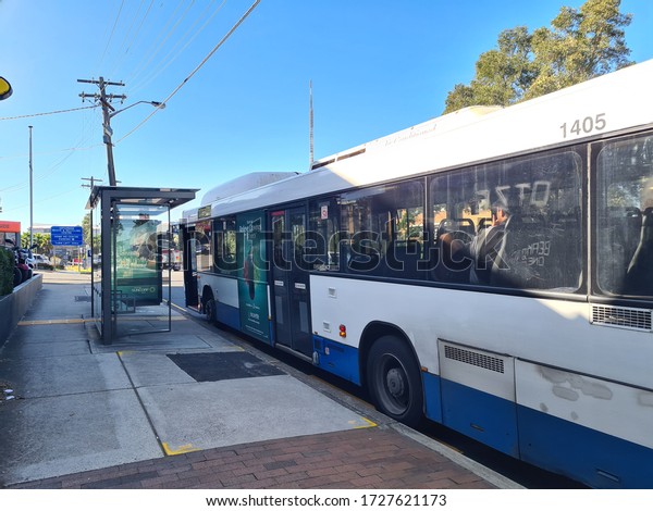 Sydney, NSW / Australia - Oct 27\
2019: empty busstop to wait for board public bus service using\
cashless opal card payment in afternoon. sydney public\
transport