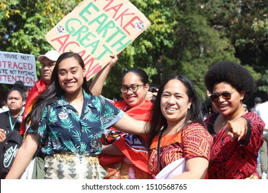 Sydney, NSW Australia - September 20 2019: The Climate Change Strike. A Happy Smiling Group Of South Pacific Islander Women In Traditional Dress. Holding A Sign Reading 