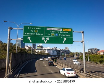 Sydney, NSW Australia-July 17 2022: Directional Road Sign For Sydney Harbour Bridge, The Eastern Suburbs, And Wollongong Over The Motorway.