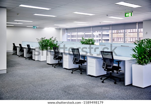 Sydney, NSW/Australia-July 14\
2018: interior photography of commercial fit out of corporate\
office in minimalist modern design in whites and greys, office work\
stations